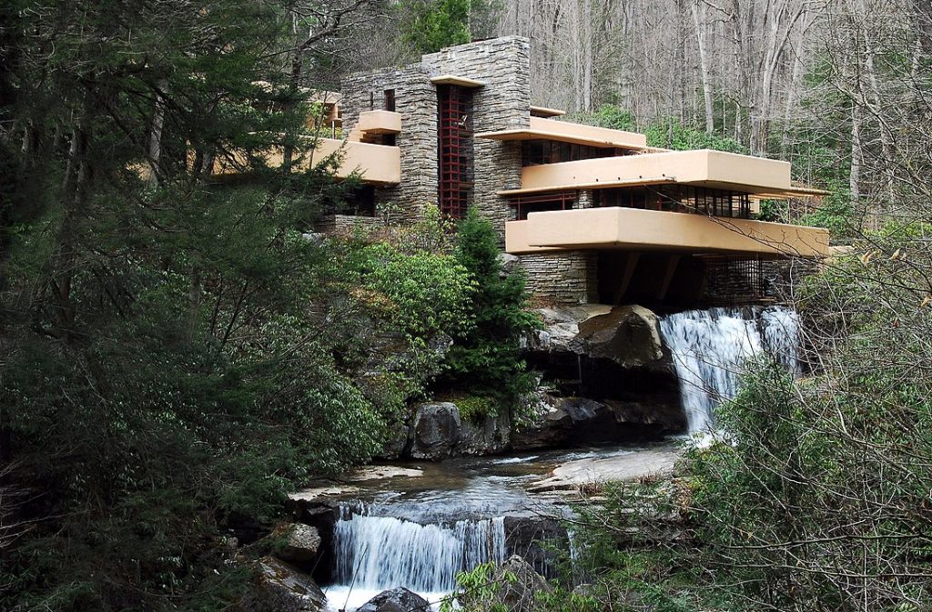 Fallingwater — a project by Frank Lloyd Wright that integrates the architectural mass into the natural landscape, where the architecture becomes a direct extension of rock and water.