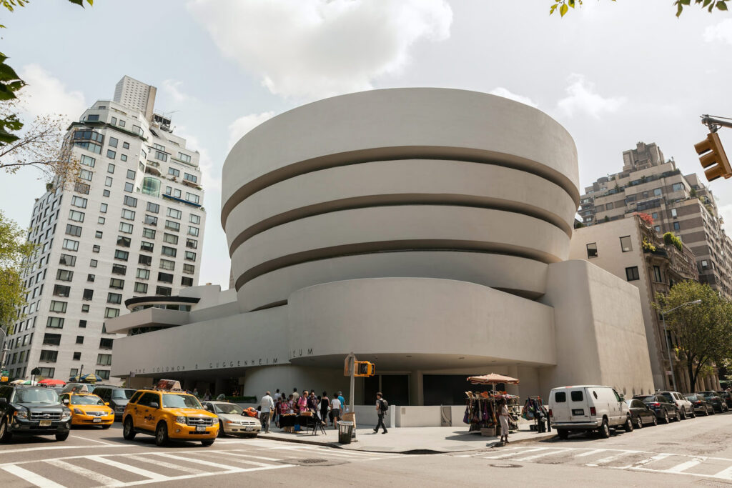 The Guggenheim Museum — a continuous spiral mass that redefined the museum-going experience as a single, gradually unfolding architectural path.