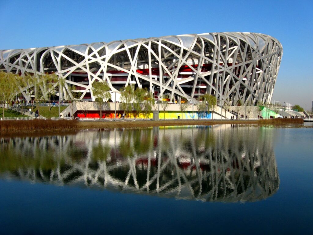 The National Stadium in Beijing, known as the "Bird's Nest." Here the mass became a visible structural lattice of interwoven steel, turning the structure itself into an architectural language that combines symbolic expression with technical daring.