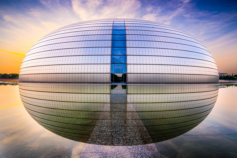 The National Centre for the Performing Arts, popularly known as "The Giant Egg," Beijing, China. An abstract ellipsoidal mass surrounded by water, redefining ceremonial space through reflection and abstraction.